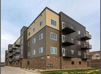 a building with a lot of windows and balconies at Beacon Estates, Fargo, ND, 58103
